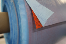 Close-up swatch of the Knitflow 160 knitted mesh and Wrightlon 3700 P16 release film