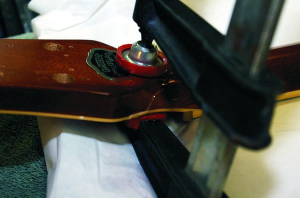 Guitar body clamped while an epoxy bond cures.